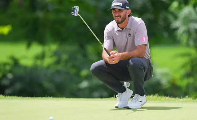 Brian Harman lines up a putt on the eighth hole during the first round of the Charles Schwab Challenge golf tournament at Colonial Country Club in Fort Worth, Texas, Thursday, May 28, 2026. (AP Photo/LM Otero)