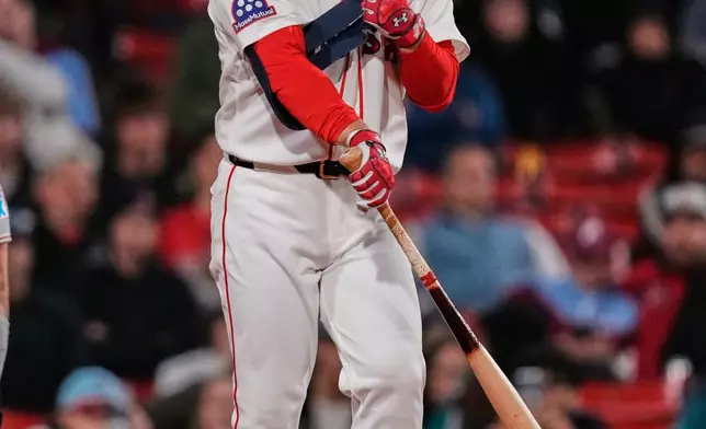 Boston Red Sox's Masataka Yoshida draws a walk during the ninth inning of a baseball game against the Philadelphia Phillies, Thursday, May 14, 2026, in Boston. (AP Photo/Charles Krupa)