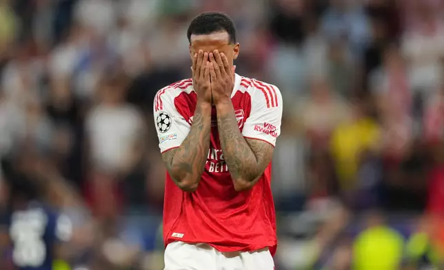 Arsenal's Gabriel Magalhaes reacts after missing to score during the penalty shoot out at the Champions League final soccer match between Paris Saint-Germain and Arsenal in Budapest, Hungary, Saturday, May 30, 2026. (AP Photo/Andreea Alexandru)