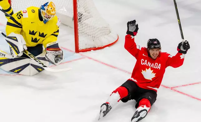 Canada's Robert Thomas celebrates after teammate Dylan Cozens scored a goal during a Group B preliminary round game between Canada and Sweden at the men's ice hockey world championship in Fribourg, Switzerland, Friday, May 15, 2026. (Salvatore Di Nolfi/Keystone via AP)