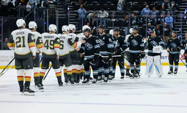 Utah Mammoth congratulate the Vegas Golden Knights after the game win to advance of Game 6 in the first round of an NHL hockey Stanley Cup playoff series, Friday, May 1, 2026, in Salt Lake City. (AP Photo/Melissa Majchrzak)