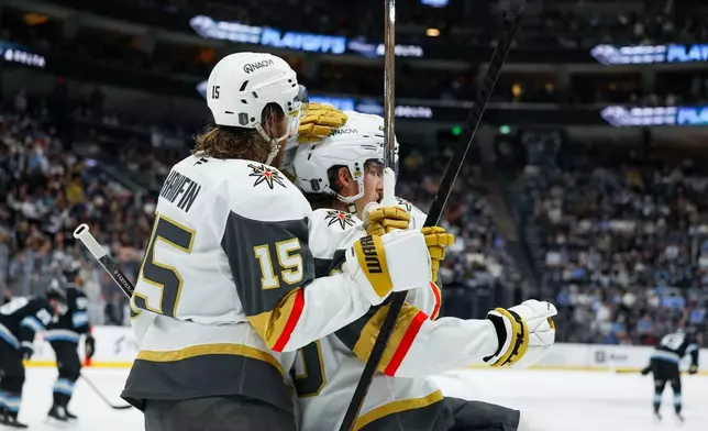 Vegas Golden Knights defenseman Noah Hanifin (15) and right wing Mitch Marner (93) celebrate a goal against the Utah Mammoth during the second period of Game 6 in the first round of an NHL hockey Stanley Cup playoff series, Friday, May 1, 2026, in Salt Lake City. (AP Photo/Melissa Majchrzak)