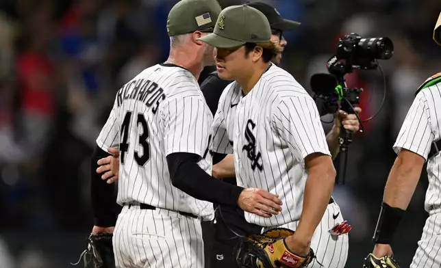 Chicago White Sox's Munetaka Murakami, right, celebrates with closing pitcher Trevor Richards (43) after defeating the Chicago Cubs in a baseball game in Chicago, Saturday, May 16, 2026. (AP Photo/Paul Beaty)