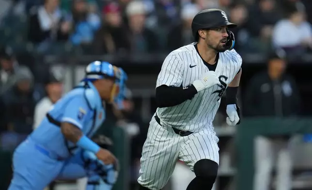 Chicago White Sox's Randal Grichuk (34) takes off after hitting a two-run single during the third inning of a baseball game against the Kansas City Royals, Thursday, May 14, 2026, in Chicago. (AP Photo/Erin Hooley)