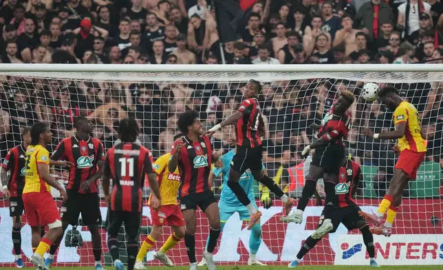 Lens' Odsonne Edouard, right, scores a goal during the French Cup soccer final between Nice and Lens in Saint-Denis, outside Paris, Friday, May 22, 2026. (AP Photo/Thibault Camus)