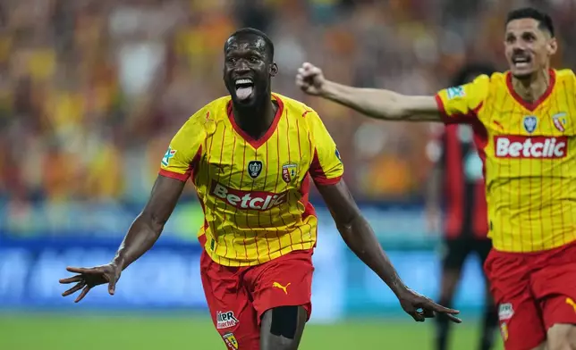 Lens' Abdallah Sima celebrates after scoring during the French Cup soccer final between Nice and Lens in Saint-Denis, outside Paris, Friday, May 22, 2026. (AP Photo/Thibault Camus)