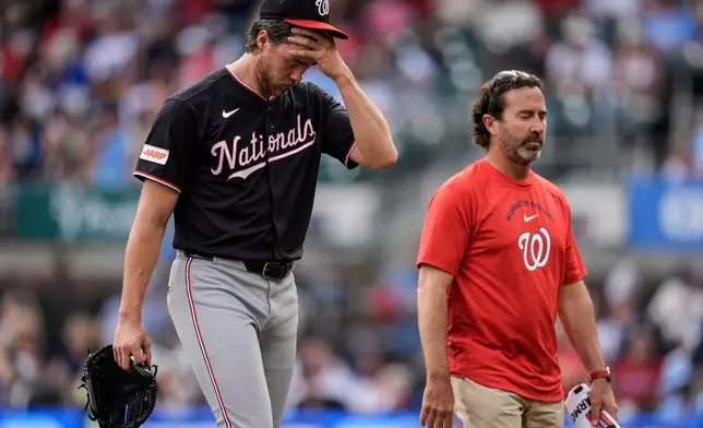 Washington Nationals pitcher Jake Irvin walks off the mound in the sixth inning of a baseball game against the Atlanta Braves, Saturday, May 23, 2026, in Atlanta. (AP Photo/Mike Stewart)