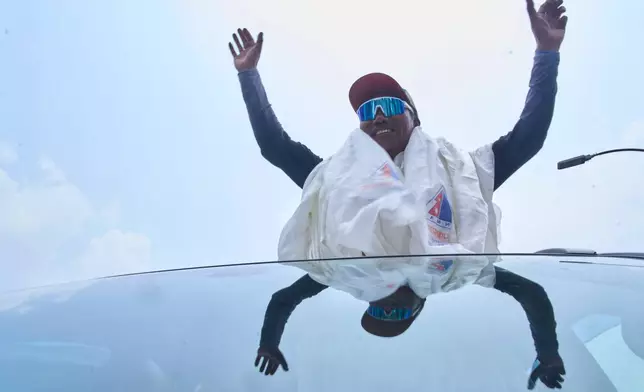 Renowned Sherpa mountain guide Kami Rita returning from Mount Everest after his record 32nd successful ascent, is welcomed as he arrives at an airport in Kathmandu, Nepal, Friday, May 22, 2026. (AP Photo/Niranjan Shrestha)