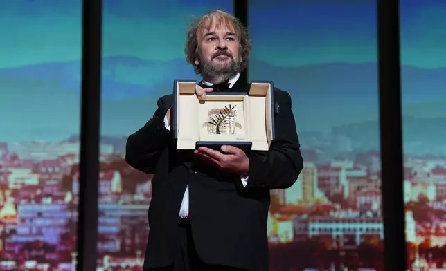 Director Peter Jackson, recipient of the honorary Palme d'Or, poses for photographers during the opening ceremony of the 79th international film festival, Cannes, southern France, Tuesday, May 12, 2026. (Photo by Scott A Garfitt/Invision/AP)