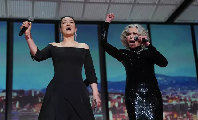 Gong Li, left, and Jane Fonda appear during the opening ceremony of the 79th international film festival, Cannes, southern France, Tuesday, May 12, 2026. (Photo by Scott A Garfitt/Invision/AP)