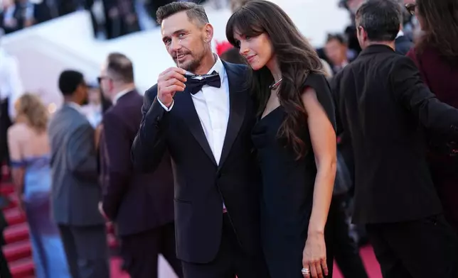 James Franco, left, and Izabel Pakzad pose for photographers at the opening ceremony and premiere of the film 'The Electric Kiss' during 79th international film festival, Cannes, southern France, Tuesday, May 12, 2026. (Photo by Scott A Garfitt/Invision/AP)