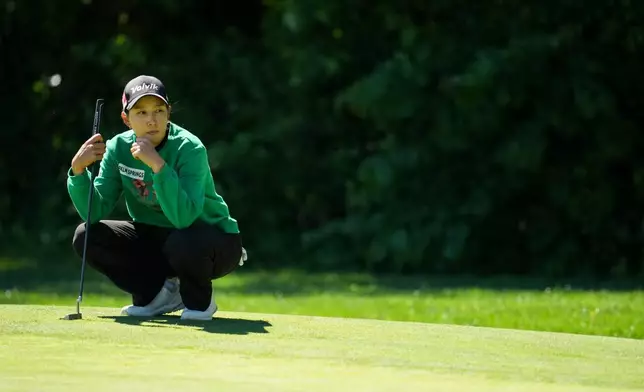 Chella Choi looks over the sixth green during the first round of the Queen City Championship LPGA golf tournament at Maketewah Country Club, Thursday, May 14, 2026, in Cincinnati. (AP Photo/Jeff Dean)