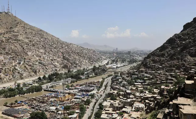 A general view of a road commonly used by cargo trucks entering eastern Kabul, Afghanistan, Wednesday, May 13, 2026. (AP Photo/Siddiqullah Alizai)