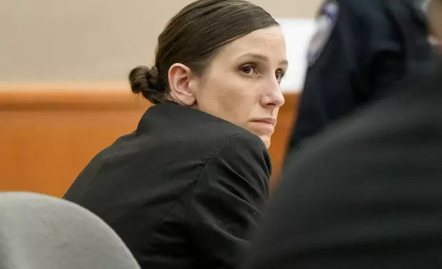 FILE -Kouri Richins looks on during her murder trial at the Summit County Courthouse in Park City, Utah, Monday, Feb. 23, 2026. (AP Photo/Spenser Heaps, Pool, File)