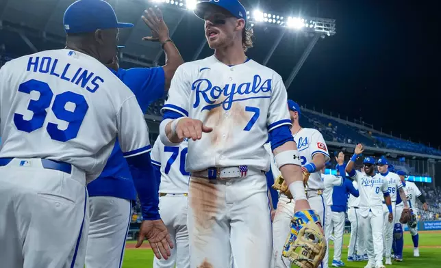 Kansas City Royals shortstop Bobby Witt Jr. (7) celebrates with teammates after their baseball game against the Cleveland Guardians, Monday, May 4, 2026, in Kansas City, Mo. (AP Photo/Charlie Riedel)