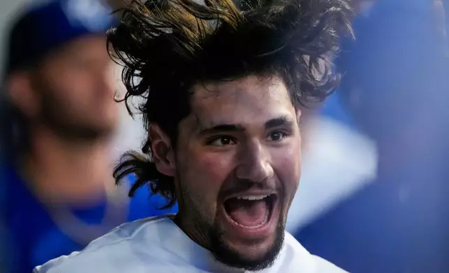 Kansas City Royals' Jac Caglianone celebrates in the dugout after hitting a solo home run during the sixth inning of a baseball game against the Cleveland Guardians, Monday, May 4, 2026, in Kansas City, Mo. (AP Photo/Charlie Riedel)
