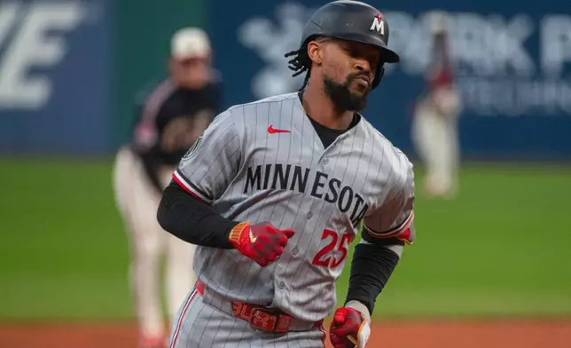 Minnesota Twins' Byron Buxton rounds the bases after hitting a solo home run off Cleveland Guardians starting pitcher Tanner Bibee during the first inning of a baseball game, Saturday, May 9, 2026, in Cleveland. (AP Photo/Phil Long)