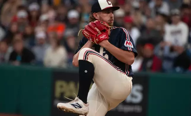 Cleveland Guardians starting pitcher Tanner Bibee winds up to deliver against the Minnesota Twins during the first inning of a baseball game, Saturday, May 9, 2026, in Cleveland. (AP Photo/Phil Long)