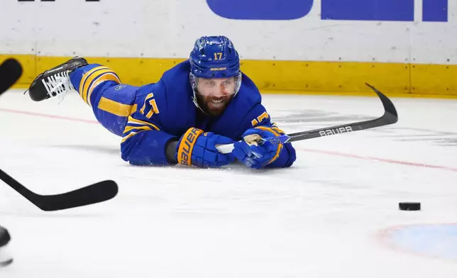 Buffalo Sabres left wing Jason Zucker is tripped during the first period in Game 2 of a second-round NHL hockey Stanley Cup playoff series against the Montreal Canadiens, Friday, May 8, 2026, in Buffalo, N.Y. (AP Photo/Jeffrey T. Barnes)