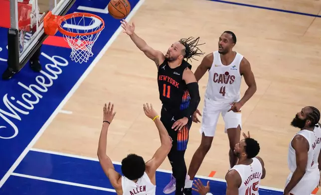 New York Knicks guard Jalen Brunson (11) shoots during the second half of Game 2 in the Eastern Conference finals NBA basketball playoffs series against the Cleveland Cavaliers, Thursday, May 21, 2026, in New York. (AP Photo/Yuki Iwamura)