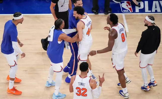 New York Knicks guard Landry Shamet (44) celebrates with teammates after scoring a three-point basket during the first overtime of Game 1 in the Eastern Conference finals NBA basketball playoffs series against the Cleveland Cavaliers, Tuesday, May 19, 2026, in New York. (AP Photo/Yuki Iwamura)