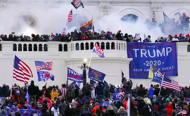FILE - Rioters storm the West Front of the U.S. Capitol Jan. 6, 2021, in Washington. (AP Photo/John Minchillo, File)