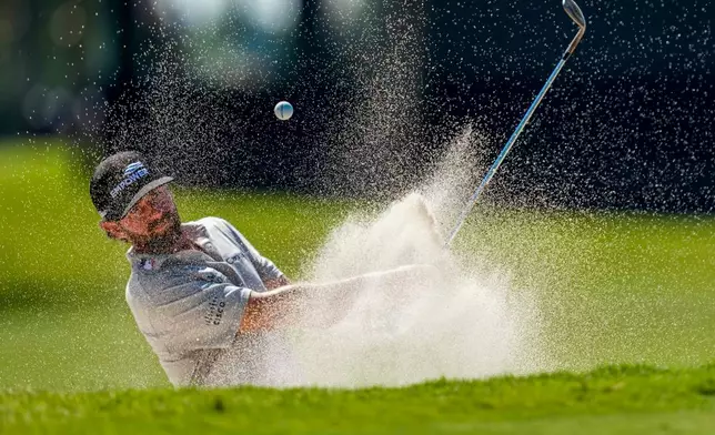 Cameron Young hits from the bunker on the eighth green during the second round of the Cadillac Championship PGA golf tournament Friday, May 1, 2026, in Doral, Fla. (AP Photo/David J. Phillip)