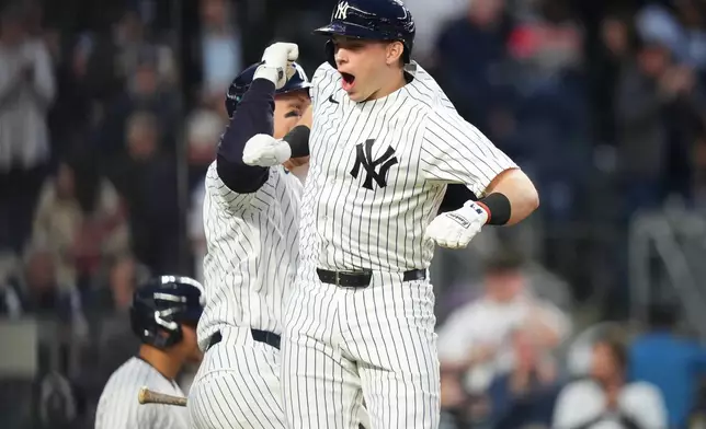 New York Yankees' Ben Rice celebrates with Aaron Judge, left, after hitting a three-run home run during the second inning of a baseball game against the Baltimore Orioles Friday, May 1, 2026, in New York. (AP Photo/Frank Franklin II)