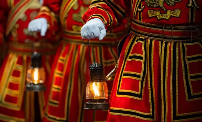 Yeoman warders take part in the ceremonial search ahead of the state opening of Parliament at the Houses of Parliament in London, Wednesday May 13, 2026. (Carl Court/Pool Photo via AP)