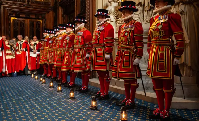 Yeoman warders take part in the ceremonial search ahead of the state opening of Parliament at the Houses of Parliament in London, Wednesday May 13, 2026. (Carl Court/Pool Photo via AP)