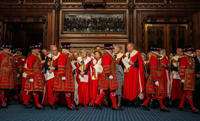 Peers look on as Yeoman warders take part in the ceremonial search ahead of the state opening of Parliament at the Houses of Parliament in London, Wednesday May 13, 2026. (Carl Court/Pool Photo via AP)