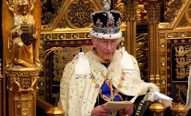FILE - King Charles III looks up as he reads the King's Speech, during the State Opening of Parliament in the House of Lords in London on July 17, 2024. (AP Photo/Kirsty Wigglesworth, Pool, File)