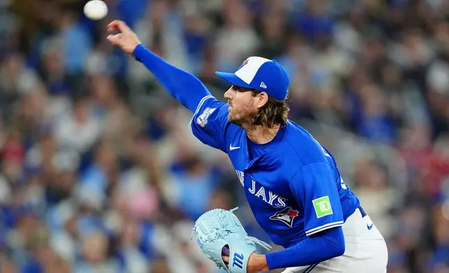 Toronto Blue Jays pitcher Kevin Gausman works against the Tampa Bay Rays during first-inning baseball game action in Toronto, Monday, May 11, 2026. (Frank Gunn/The Canadian Press via AP)