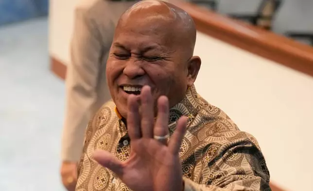 Philippine Senator Ronald dela Rosa gestures to reporters at the Philippine Senate in Pasay, Philippines on Wednesday, May 13, 2026. (AP Photo/Aaron Favila)