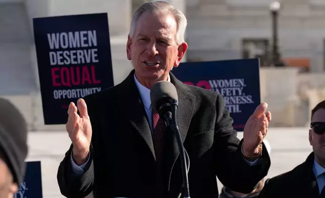 FILE - Sen. Tommy Tuberville, R-Ala., speaks to the crowd as protesters gather outside the Supreme Court as it hears arguments over state laws barring transgender girls and women from playing on school athletic teams, Jan. 13, 2026, in Washington. (AP Photo/Jose Luis Magana, File)