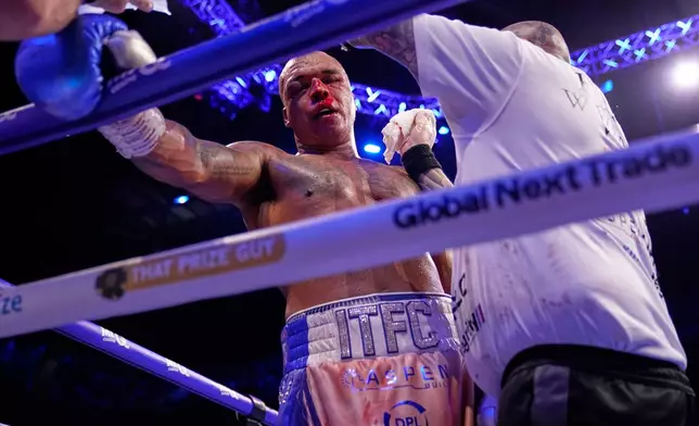 Britain's Fabio Wardley Britain's is inspected in a a break against Daniel Dubois during their WBO World Heavyweight boxing title bout in Manchester, Saturday, May 9, 2026. (AP Photo/Dave Thompson)