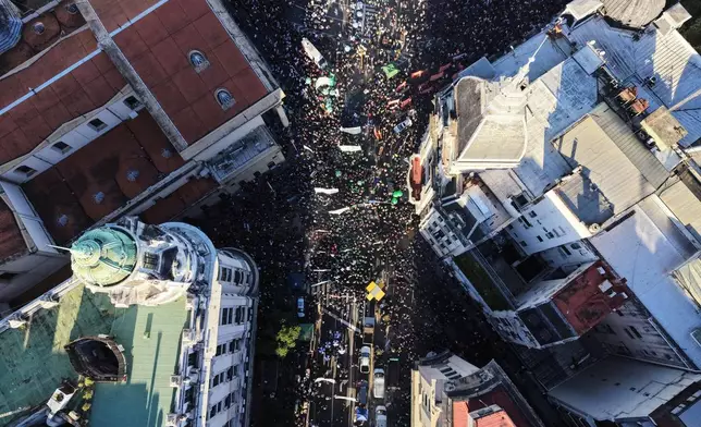 People protest for more public university funding in Buenos Aires, Argentina, Tuesday, May 12, 2026. (AP Photo/Rodrigo Abd)
