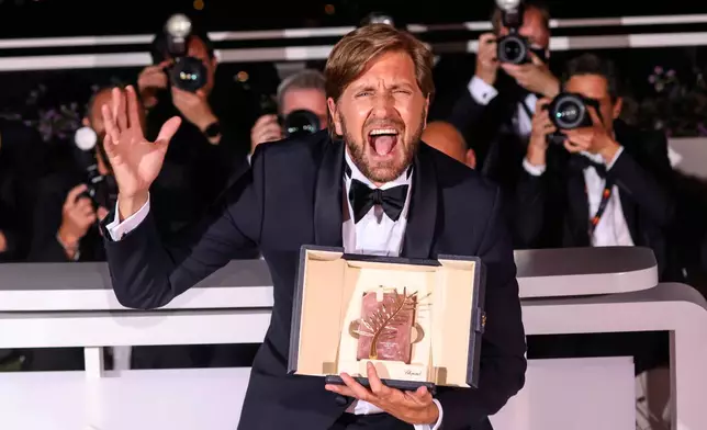 FILE - Writer-director Ruben Ostlund, winner of the Palme d'Or for "Triangle of Sadness," poses at the 75th international film festival, Cannes, southern France, Saturday, May 28, 2022. (Photo by Vianney Le Caer/Invision/AP, File)