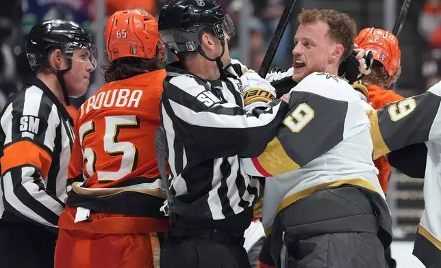 Vegas Golden Knights' Jack Eichel (9) is separated from Anaheim Ducks' Jacob Trouba (65) during the second period of an NHL hockey game Sunday, May 10, 2026, in Anaheim, Calif. (AP Photo/Scott Strazzante)