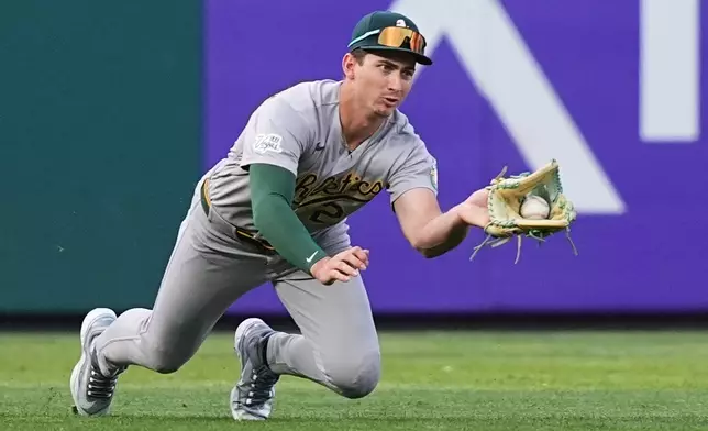 Athletics' Tyler Soderstrom catches a line out hit by Philadelphia Phillies' Trea Turner during the first inning of a baseball game, Tuesday, May 5, 2026, in Philadelphia. (AP Photo/Matt Rourke)