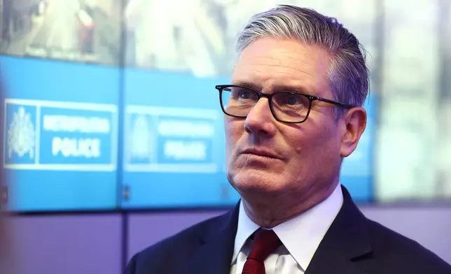 British Prime Minister Keir Starmer meets police officers to discuss operational planning, in London, Friday, May 15, 2026. (Peter Nicholls/Pool Photo via AP)