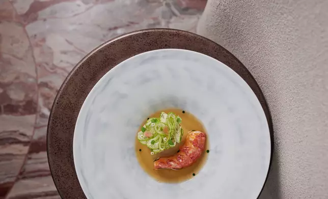 Blue lobster poached in lobster butter arrives with a fermented pineapple brunoise and a trio of zucchini textures; lifted by a shellfish consommé giving sweet, tangy notes.