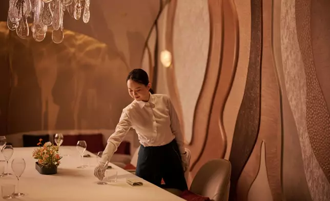 A tumbled-glass chandelier by Lasvit adds a final poetic touch to the private room at Estuary by Vicky Cheng, casting waterlike reflections and natural textures that complete the sensory landscape.