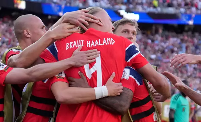 Norway's Erling Haaland (9), center, celebrates with teammates after scoring his side's second goal during the World Cup Group I soccer match between Iraq and Norway in Foxborough, Mass., near Boston, Tuesday, June 16, 2026. (AP Photo/Charles Krupa)