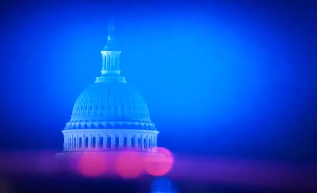 The U.S. Capitol is visible as the motorcade with President Donald Trump heads from the White House to Joint Base Andrews, Md., Monday, June 15, 2026. (AP Photo/Julia Demaree Nikhinson)