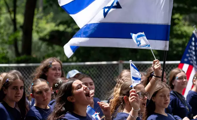 A parade participant cheers on the crowd during the Israel Day Parade, Sunday, May 31, 2026, in New York. (AP Photo/Emil T. Lippe)