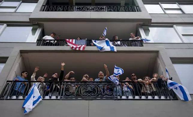 Spectators cheer on parade participants during the Israel Day Parade, Sunday, May 31, 2026, in New York. (AP Photo/Emil T. Lippe)