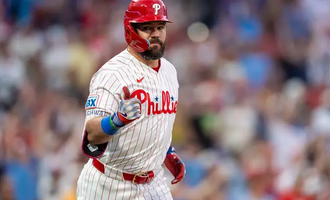 Philadelphia Phillies' Kyle Schwarber gives a thumbs-up after hitting a home run during the third inning of a baseball game against the New York Mets, Saturday, June 20, 2026, in Philadelphia. (AP Photo/Chris Szagola)