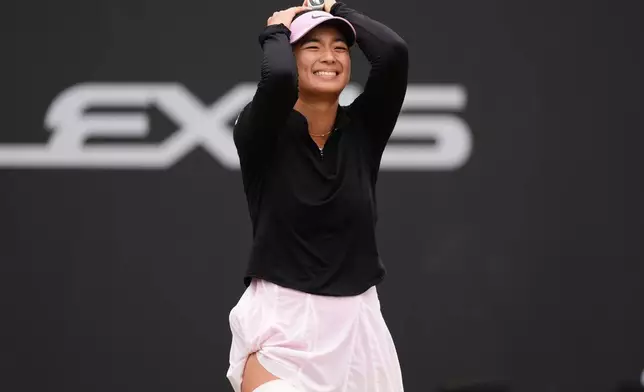 Philippines' Alexandra Eala celebrates winning her women's singles final match against Nikola Bartunkova on day nine of the Lexus Birmingham Open Championships at Edgbaston Priory Club, Birmingham, England, Sunday June 7, 2026. (Mike Egerton/PA via AP)