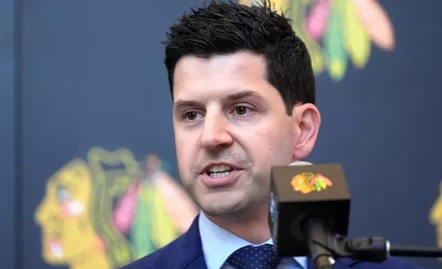 FILE - Chicago Blackhawks General Manager Kyle Davidson speaks at a news conference during the team's NHL hockey camp in Chicago, Sept. 19, 2024. (AP Photo/Charles Rex Arbogast, File)